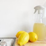 Natural Cleaning - yellow lemon fruit beside clear glass bottle