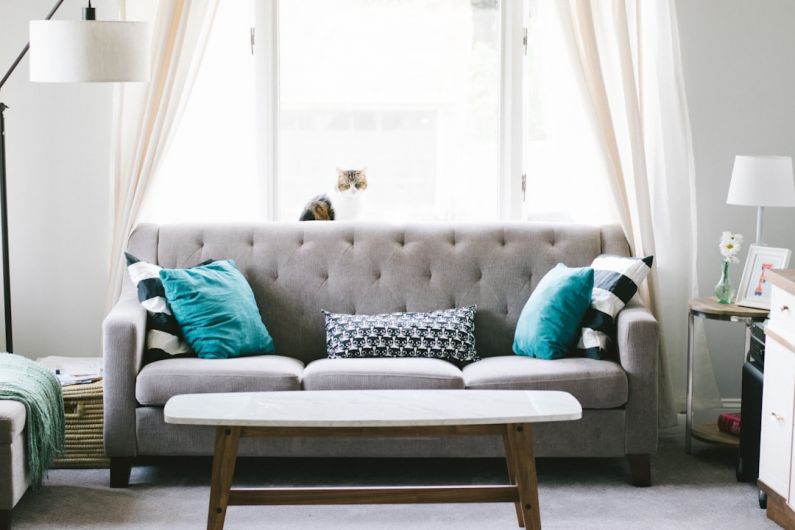 Spring Decor - brown and white wooden table beside sofa chair